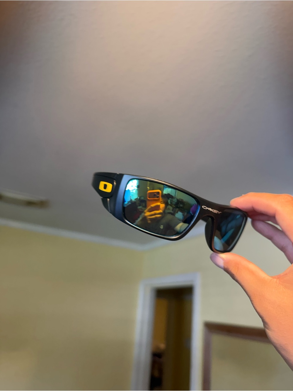 Oakley Black Frame Sunglasses with Blue-Green Mirrored Lenses Oakley Oakleys